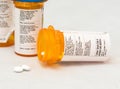 Opioid Pill Bottle has a few pills spilling out. Royalty Free Stock Photo