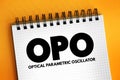 OPO - Optical Parametric Oscillator acronym text on notepad, abbreviation concept background