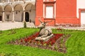 View of the deer statue in the middle of flower bed