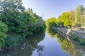 Summer view on Mlynowka canal between trees in city center of Opole Royalty Free Stock Photo