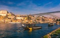 Oporto or Porto city skyline, Douro river, traditional boats and Dom Luis or Luiz iron bridge. Porto, Portugal, Europe Royalty Free Stock Photo