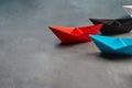 Opportunities leadership Business Concept-Paper Boat key opinion Leader, influence concept. One black paper boat as a Leader, Royalty Free Stock Photo