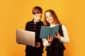 Opportunities for studying. Little children enjoy studying together yellow background. Small girl and boy hold book and Royalty Free Stock Photo