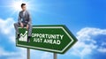 Opportunity, Just Ahead Road Sign Against Clouds and Sunburst Royalty Free Stock Photo