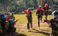 Opposing teams of nice kids shooting paintball Royalty Free Stock Photo