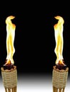 Opposite Tiki Torches Royalty Free Stock Photo