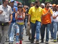 Opposition lawmaker Juan Requesens, yellow, is escorted by his colleague