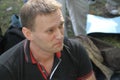 Opposition leader Alexei Navalny listens to speeches at the meeting of activists in Khimki forest.