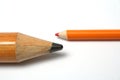 Opposition of a small and greater pencil Royalty Free Stock Photo