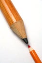 Opposition of a small and greater pencil Royalty Free Stock Photo