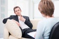 Oppressed man talking with psychologist Royalty Free Stock Photo