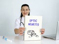 OPTIC NEURITIS text in list. Podiatrist looking for something at laptop