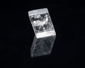 Optical Calcite from China isolated on a black mirror background. Alternative stone name: Iceland Spar