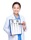 Optical doctor with eye chart and glasses Royalty Free Stock Photo