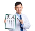 Optical doctor with eye chart and glasses Royalty Free Stock Photo