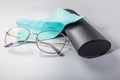 Optical glassesclose up with napkin and case. Reasing glasses on grey background