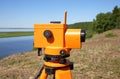 Optical level close-up against the background of a river valley and taiga Royalty Free Stock Photo