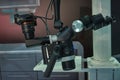 Optical system with a microscope and a movie camera to study various objects in dentistry