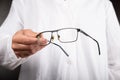 Optician doctor  gives glasses to a patient to improve vision Royalty Free Stock Photo