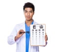 Optician doctor holding with eyechart and glassesa