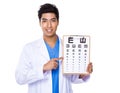 Optician doctor holding with eyechart