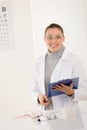 Optician doctor woman with glasses and eye chart