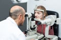 Optician doing eye examination