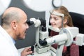 Optician doing eye examination