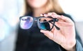 Optician, optometrist, oculist or eye doctor holding glasses and specs with new lenses. Professional eyesight specialist in clinic Royalty Free Stock Photo