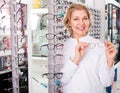 Optician standing near spectacles