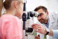 Optician with tonometer and patient at eye clinic Royalty Free Stock Photo