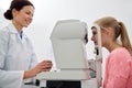 Optician with tonometer and patient at eye clinic Royalty Free Stock Photo