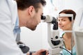 Optician with tonometer and patient at eye clinic Royalty Free Stock Photo