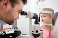 Optician with tonometer and patient at eye clinic Royalty Free Stock Photo