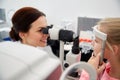 Optician with tonometer and patient at eye clinic Royalty Free Stock Photo