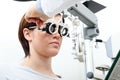 Optician with trial frame, optometrist doctor examines eyesight Royalty Free Stock Photo