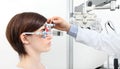 Optician with trial frame, optometrist doctor examines eyesight Royalty Free Stock Photo