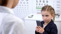 Optician trying to take cellphone from naughty child, video games damage sight