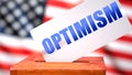 Optimism and American elections, symbolized as ballot box with American flag in the background and a phrase Optimism on a ballot Royalty Free Stock Photo