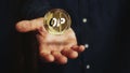 Optimism OP cryptocurrency golden 3d coin over hand