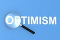 Optimism word with magnifying glass