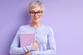 Optimistic cheerful lady in eyeglasses is ready to study, to go university