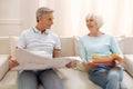 Optimistic clever elderly couple sharing their thoughts Royalty Free Stock Photo