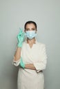 Optimistic doctor woman with syringe on white. Medicine, cosmetology and vaccination concept