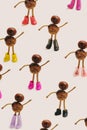 Optimistic fashion shoes concept. Pattern made of many brown chestnuts with. Minimal beige background