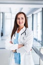 Optimistic female doctor posing at hospital indoor