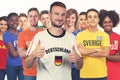 Optimistic german football fan with group of other european supporters