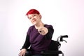 Optimistic Girl in wheelchair with thumbs up