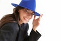 Optimistic happy woman in blue hat posing isolated