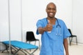 Optimistic mature adult afro american male doctor at vaccination station